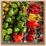 Vegetable stand with a variety of gords and vine grown vegetables